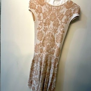 Blooming Beauty: Embrace Effortless Style with a Beige Floral Ronny Kobo Dress!